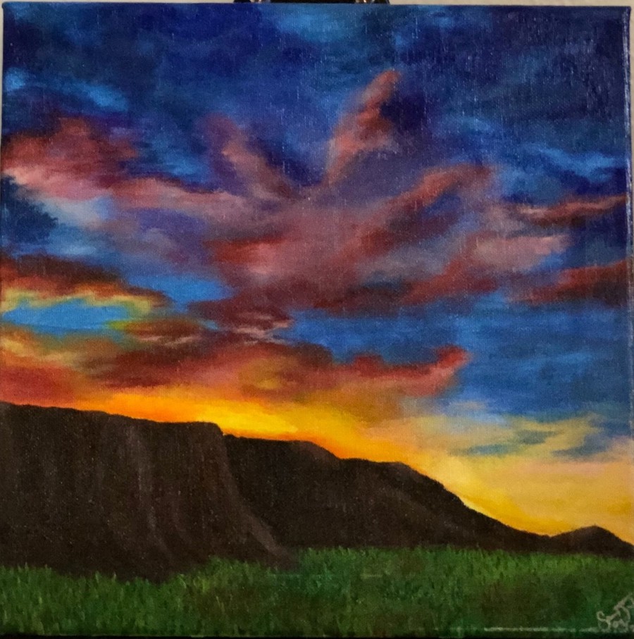 A landscape painting of the sun setting behind a mesa.