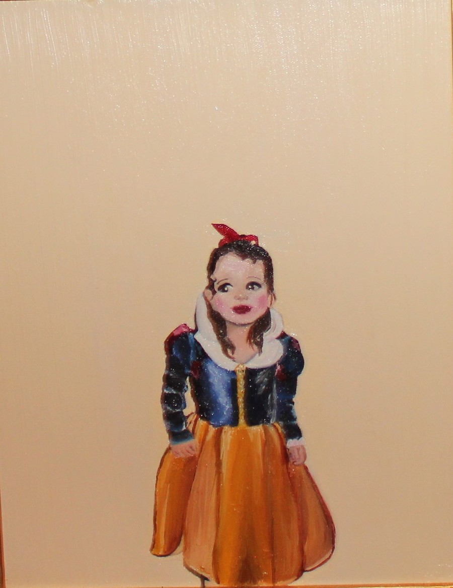 Portrait of a little girl dressed as Snow White.