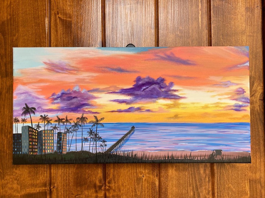 A sunset landscape painting containing a beach with a long boardwalk, tall palm trees, and tall buildings in the foreground.
