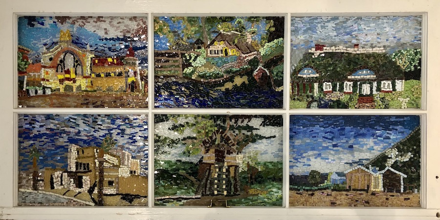 A mosaic, with six window panes, containing different styles of houses.