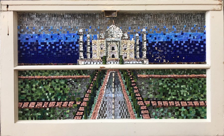 A mosaic of the Taj Mahal depicted on a window pane.